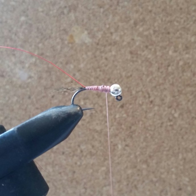 Secure the lead wire with your thread. I like to use a thread that contrasts to the Nymph-It as it will shine through when the fly gets wet. Tie in your tail material and wire rib material. Use your thread to create a nice flat body and whip finish off. You can also use some varnish or glue to make the body extra secure if you like.